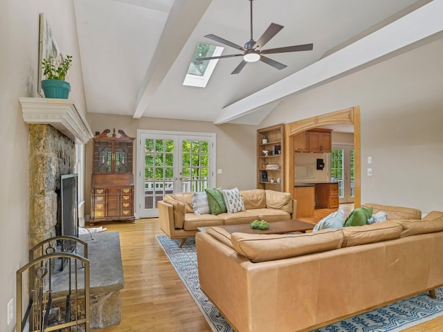 119 Deforest Rd, Wilton, CT 06897 - living room featuring ceiling fan, light wood-type flooring, a skylight, and french doors