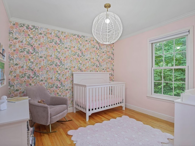 119 Deforest Rd, Wilton, CT 06897 - bedroom featuring crown molding, wood finished floors, a crib, and wallpapered walls