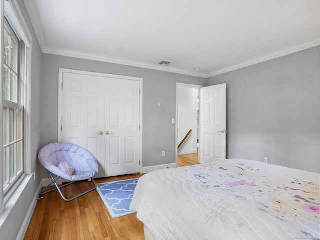 119 Deforest Rd, Wilton, CT 06897 - bedroom with a closet, crown molding, and light wood finished floors