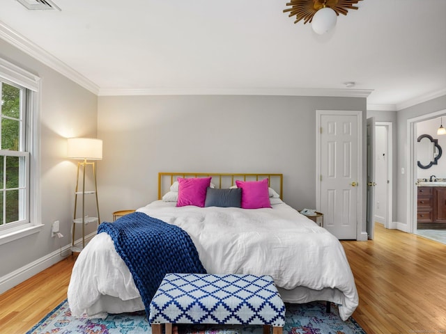119 Deforest Rd, Wilton, CT 06897 - bedroom featuring light wood-style flooring, crown molding, and ensuite bath