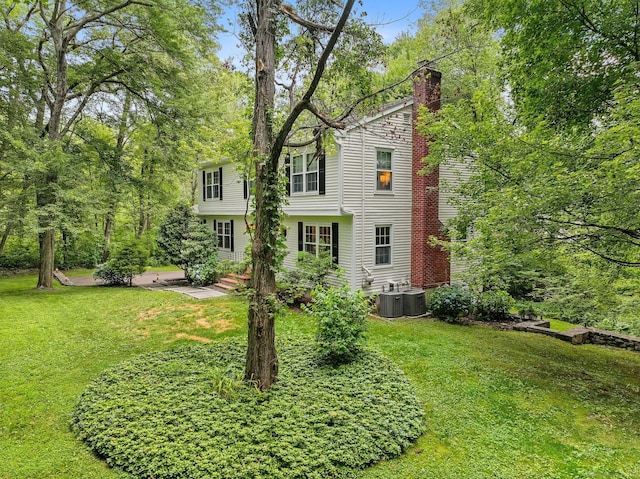 119 Deforest Rd, Wilton, CT 06897 - view of front of home with a front yard and a chimney