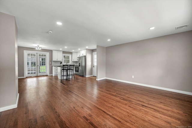 2 Riverview Pl, Cromwell, CT 06416 - unfurnished living room featuring recessed lighting and dark wood-style flooring