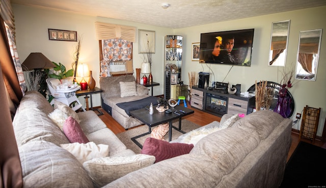 116 Michael Ave, East Hartford, CT 06108 - living area with wood finished floors and a textured ceiling