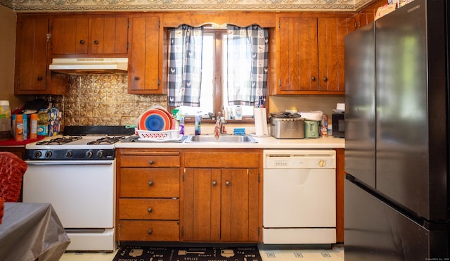 116 Michael Ave, East Hartford, CT 06108 - kitchen featuring white appliances, under cabinet range hood, light countertops, and brown cabinets