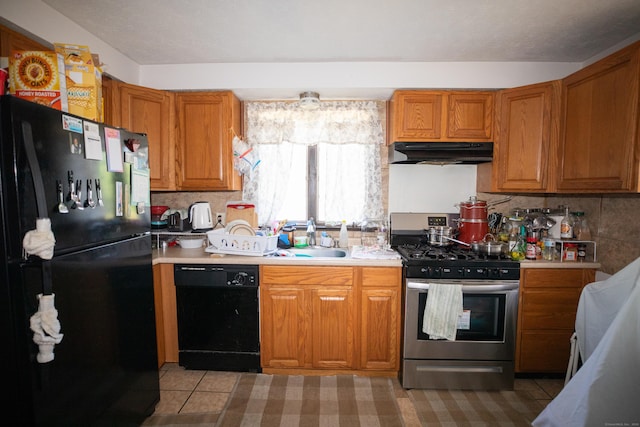 116 Michael Ave, East Hartford, CT 06108 - kitchen with black appliances, under cabinet range hood, brown cabinets, and light countertops