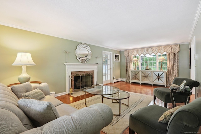 172 Mimosa Cir, Ridgefield, CT 06877 - living area with baseboard heating, ornamental molding, wood finished floors, and a brick fireplace