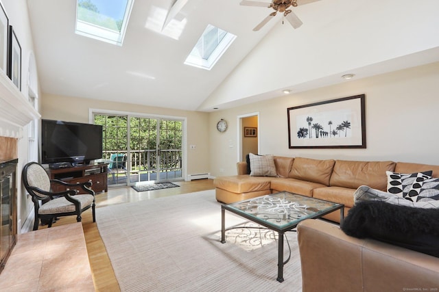 172 Mimosa Cir, Ridgefield, CT 06877 - living area with high vaulted ceiling, a baseboard heating unit, a skylight, ceiling fan, and a fireplace