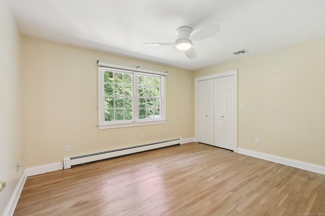 172 Mimosa Cir, Ridgefield, CT 06877 - unfurnished bedroom with baseboard heating, light wood-style flooring, a closet, and ceiling fan