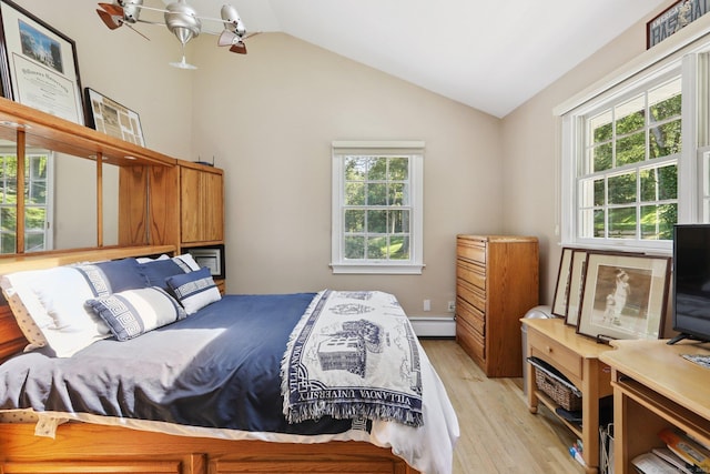 172 Mimosa Cir, Ridgefield, CT 06877 - bedroom with light wood-style floors, multiple windows, vaulted ceiling, and a baseboard radiator