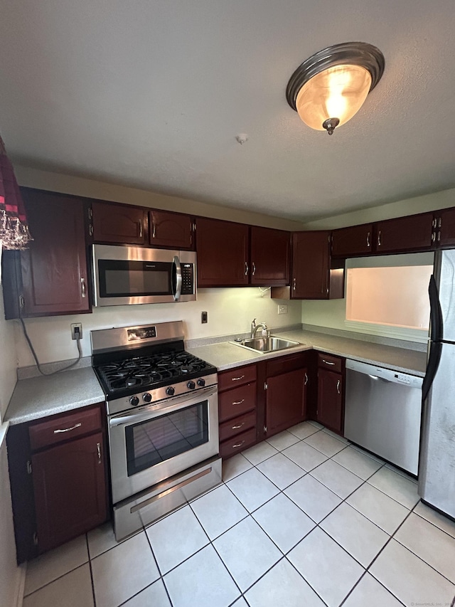 58 E Gate Ln Unit 58, Hamden, CT 06514 - kitchen with appliances with stainless steel finishes, light countertops, and light tile patterned floors