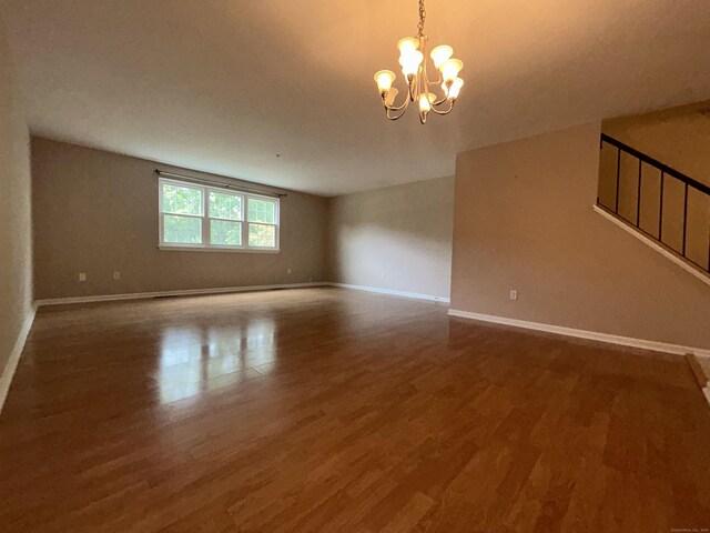 58 E Gate Ln Unit 58, Hamden, CT 06514 - spare room featuring wood finished floors and a chandelier