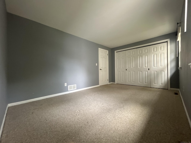58 E Gate Ln Unit 58, Hamden, CT 06514 - unfurnished bedroom featuring carpet and a closet