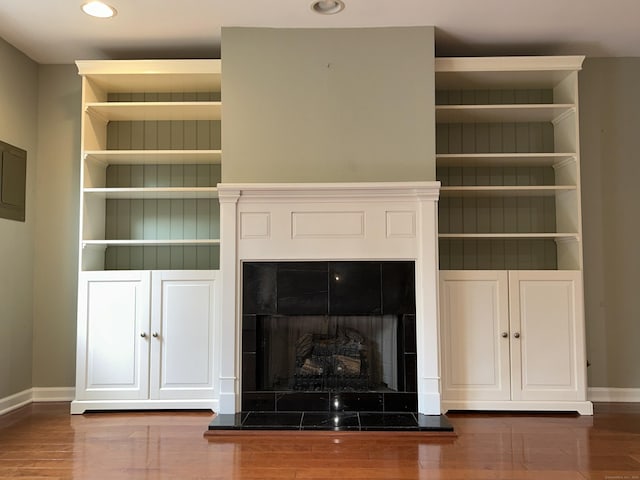 58 E Gate Ln Unit 58, Hamden, CT 06514 - detailed view of wood finished floors, recessed lighting, a fireplace, and built in shelves