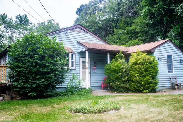 19 Upper Butcher Rd, Ellington, CT 06029 - view of front of property with a front yard and roof with shingles