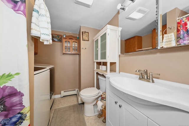 229 Hauser St, Waterbury, CT 06704 - bathroom with a baseboard radiator, vanity, tile patterned flooring, and washing machine and clothes dryer