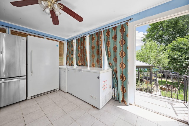 229 Hauser St, Waterbury, CT 06704 - kitchen featuring freestanding refrigerator, fridge, ceiling fan, and light tile patterned floors