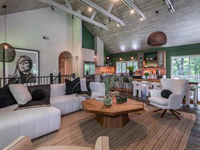 40 Revere Rd, Washington, CT 06793 - living area featuring track lighting, wood finished floors, arched walkways, and high vaulted ceiling