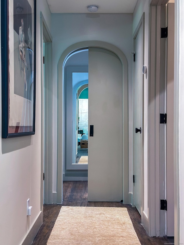 40 Revere Rd, Washington, CT 06793 - hallway with arched walkways and dark wood-style floors