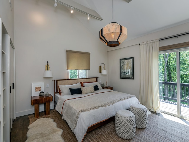 40 Revere Rd, Washington, CT 06793 - bedroom with track lighting, wood finished floors, high vaulted ceiling, and access to exterior