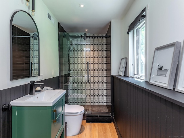 40 Revere Rd, Washington, CT 06793 - full bathroom with vanity, a stall shower, wood finished floors, a wainscoted wall, and recessed lighting