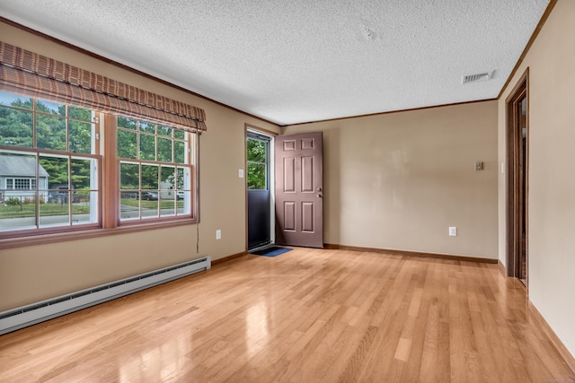 18 Saint Joseph Ct, Groton, CT 06340 - entrance foyer with baseboard heating, a textured ceiling, and light wood-type flooring