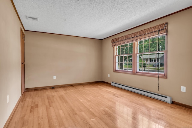 18 Saint Joseph Ct, Groton, CT 06340 - unfurnished room with a baseboard heating unit, light wood-style flooring, a textured ceiling, and crown molding