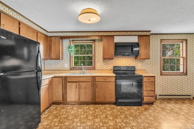 18 Saint Joseph Ct, Groton, CT 06340 - kitchen featuring black appliances, baseboard heating, a textured ceiling, light countertops, and plenty of natural light