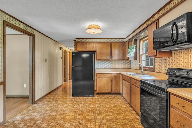 18 Saint Joseph Ct, Groton, CT 06340 - kitchen featuring black appliances, light countertops, wallpapered walls, ornamental molding, and a textured ceiling