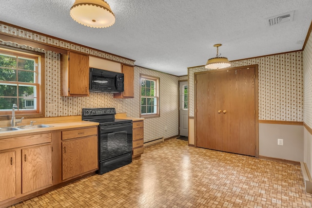 18 Saint Joseph Ct, Groton, CT 06340 - kitchen with black appliances, wallpapered walls, a baseboard heating unit, a textured ceiling, and light countertops