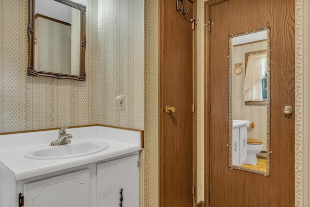 18 Saint Joseph Ct, Groton, CT 06340 - bathroom featuring wallpapered walls and vanity