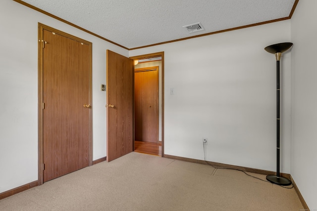 18 Saint Joseph Ct, Groton, CT 06340 - unfurnished bedroom with carpet flooring, crown molding, and a textured ceiling