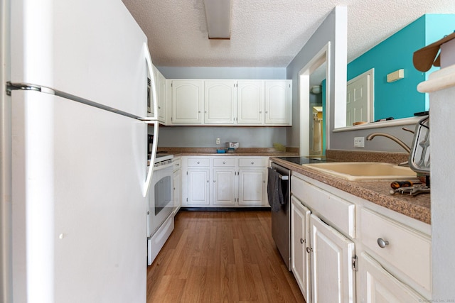 286 Laura Blvd Unit 286, Norwich, CT 06360 - kitchen with white appliances, white cabinets, dark wood-type flooring, and a textured ceiling