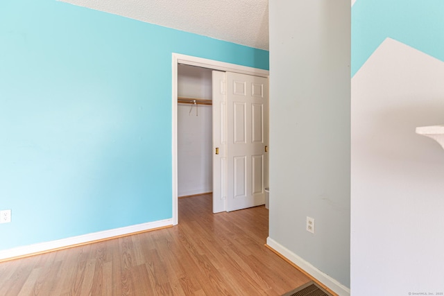 286 Laura Blvd Unit 286, Norwich, CT 06360 - unfurnished bedroom featuring wood finished floors and a closet