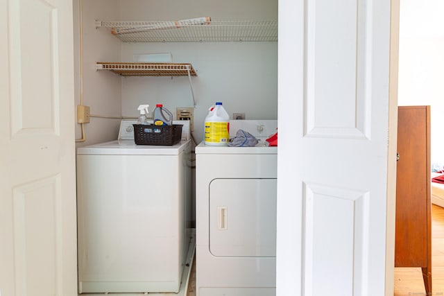 286 Laura Blvd Unit 286, Norwich, CT 06360 - washroom featuring washer and clothes dryer and light wood finished floors