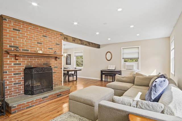215 Upper Pattagansett Rd, East Lyme, CT 06333 - living area with wood finished floors, recessed lighting, a brick fireplace, and cooling unit