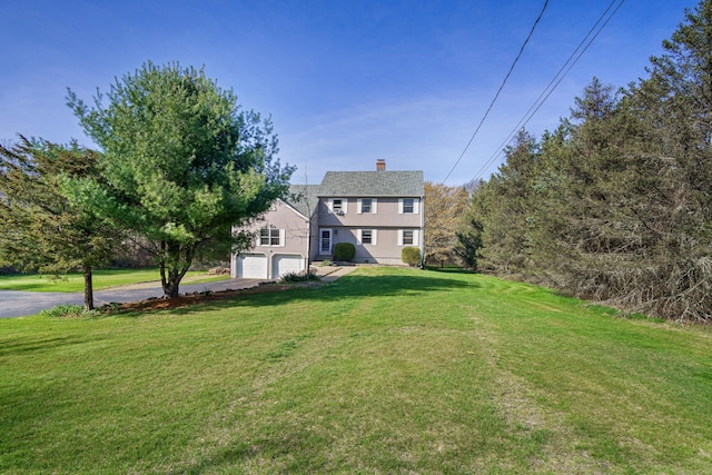 215 Upper Pattagansett Rd, East Lyme, CT 06333 - view of green lawn with asphalt driveway and a garage