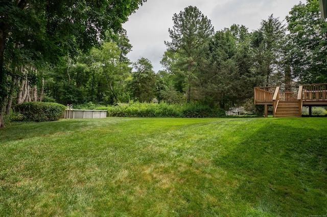 30 Streamview Cir, Guilford, CT 06437 - view of green lawn with a deck and an outdoor pool