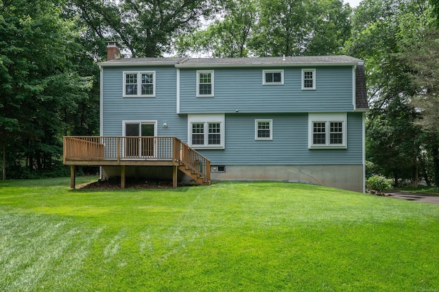 30 Streamview Cir, Guilford, CT 06437 - back of house featuring a chimney, a wooden deck, a yard, and view of wooded area