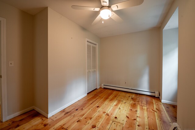 30 Streamview Cir, Guilford, CT 06437 - empty room with a baseboard radiator, light wood-type flooring, and ceiling fan