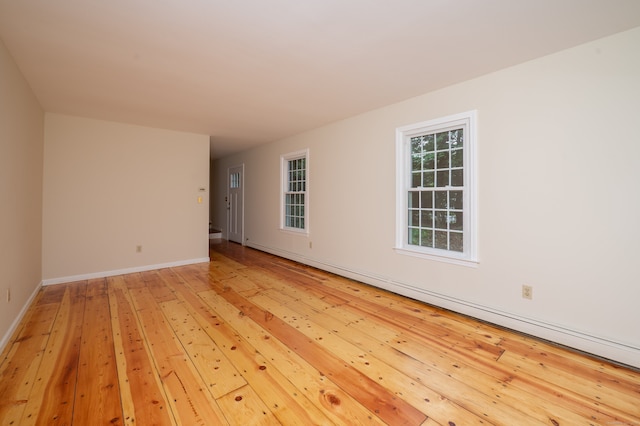 30 Streamview Cir, Guilford, CT 06437 - empty room featuring light wood-type flooring and a baseboard radiator