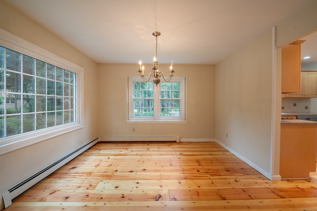 30 Streamview Cir, Guilford, CT 06437 - unfurnished dining area featuring baseboard heating, a chandelier, light wood finished floors, and a baseboard heating unit