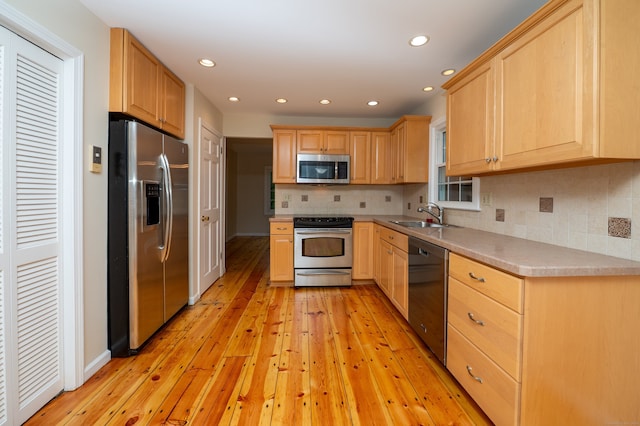 30 Streamview Cir, Guilford, CT 06437 - kitchen with stainless steel appliances, light brown cabinetry, light wood-type flooring, and recessed lighting