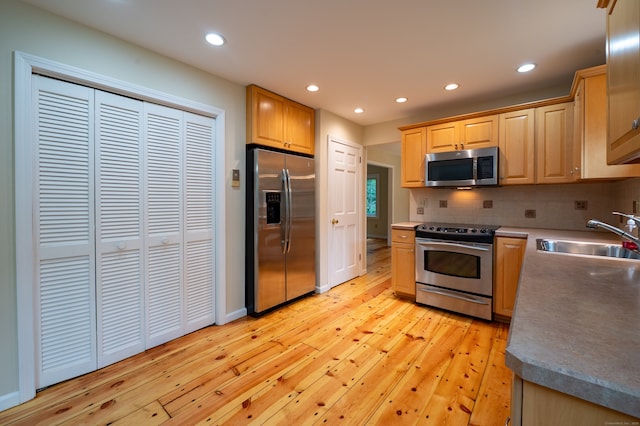 30 Streamview Cir, Guilford, CT 06437 - kitchen with stainless steel appliances, light wood-type flooring, recessed lighting, tasteful backsplash, and light brown cabinets