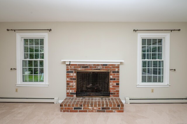 30 Streamview Cir, Guilford, CT 06437 - detailed view of a baseboard heating unit, carpet floors, and a fireplace