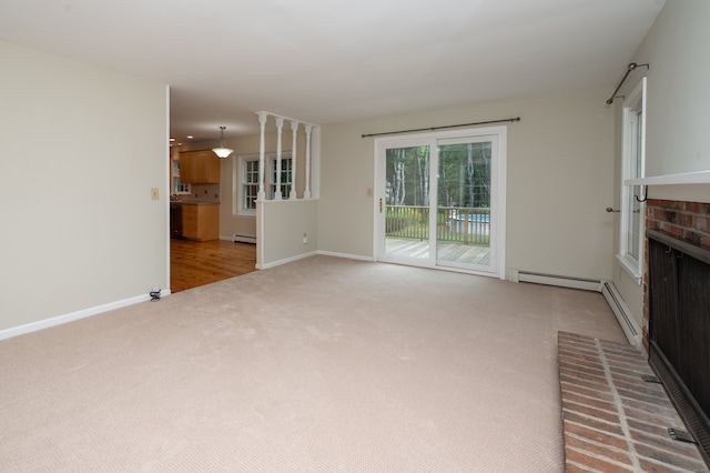 30 Streamview Cir, Guilford, CT 06437 - unfurnished living room featuring light colored carpet, a fireplace, a baseboard radiator, and baseboard heating