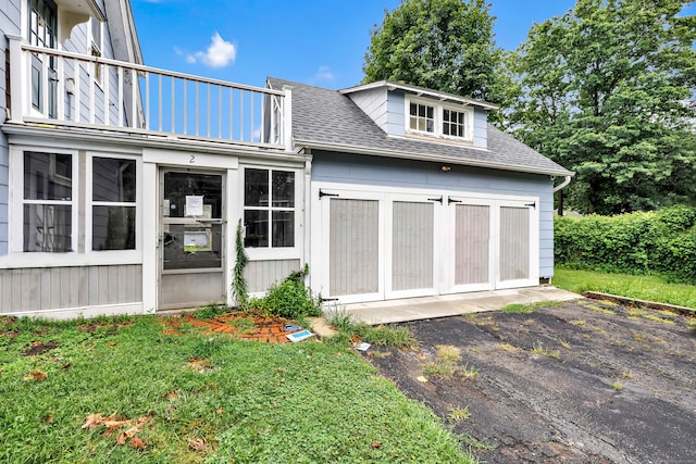2 Scofield Pl, Norwalk, CT 06855 - rear view of property featuring roof with shingles, a balcony, and a yard