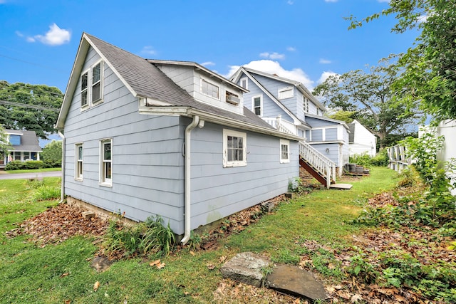2 Scofield Pl, Norwalk, CT 06855 - view of property exterior with roof with shingles and a yard