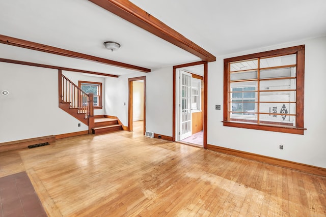 2 Scofield Pl, Norwalk, CT 06855 - unfurnished living room featuring stairway, wood-type flooring, and beamed ceiling