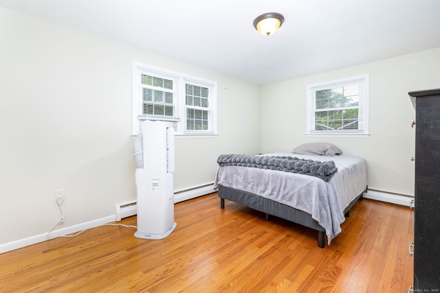 47 Dogwood Ln, Meriden, CT 06450 - bedroom featuring baseboard heating, a baseboard radiator, and light wood-type flooring