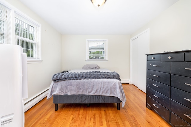 47 Dogwood Ln, Meriden, CT 06450 - bedroom with a baseboard radiator and light wood-style floors